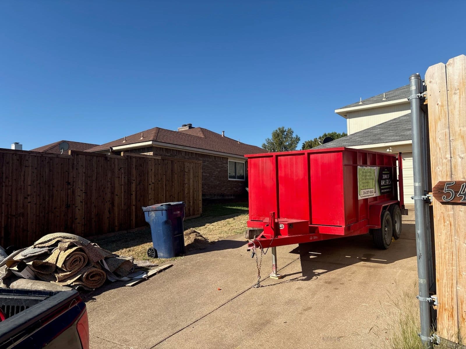 Efficient Junk Removal with Our Red Trailer image